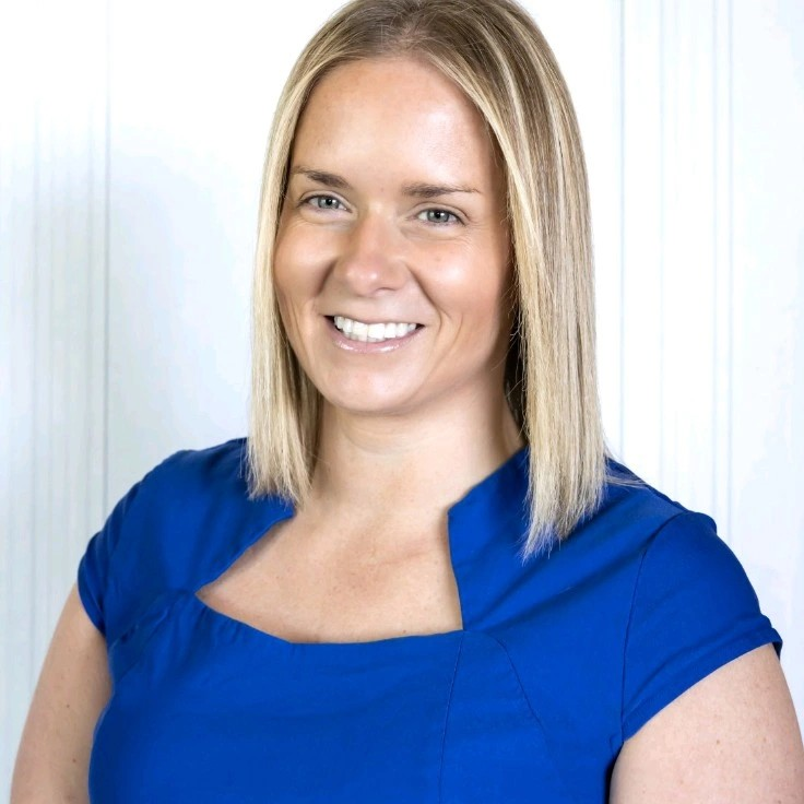 Dawn Smith, Employee Benefits Compliance Manager, South Region at Hub International seen in bright blue color outfit